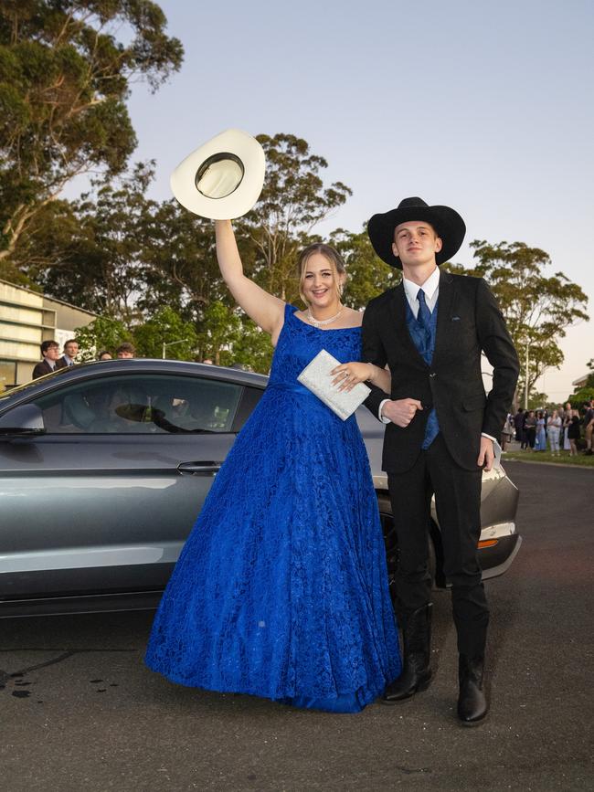 Hannah Thompson (left) and Dylan Booth arrive at Harristown State High School formal at Highfields Cultural Centre, Friday, November 18, 2022. Picture: Kevin Farmer