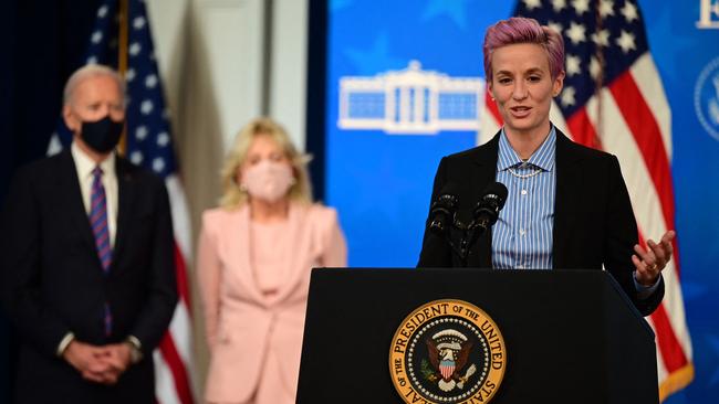 US soccer player Megan Rapinoe speaks, flanked by US President Joe Biden and First Lady Jill Biden, during an Equal Pay Day. Picture: AFP