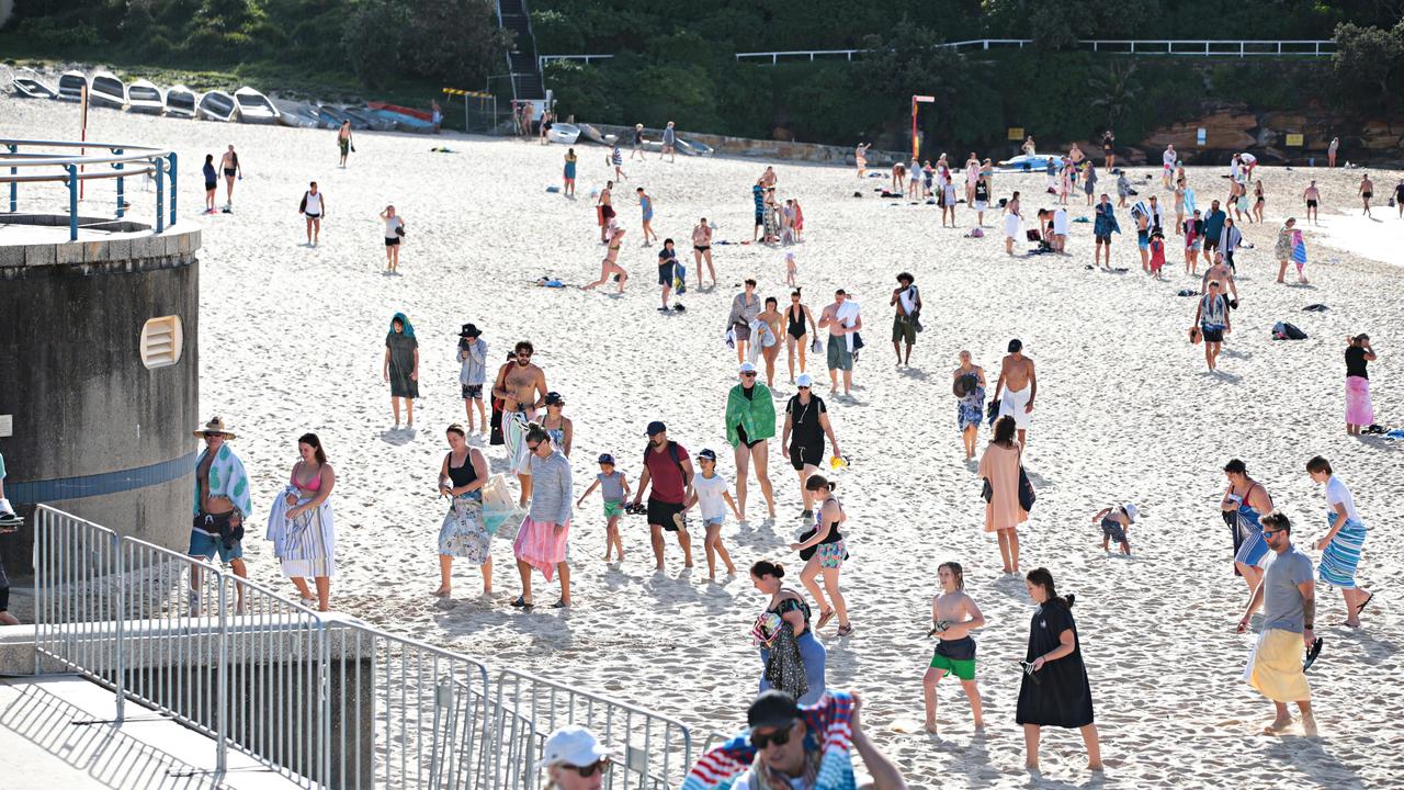 Large crowds leaving Coogee beach after 9am closure on April 26. Picture: Adam Yip