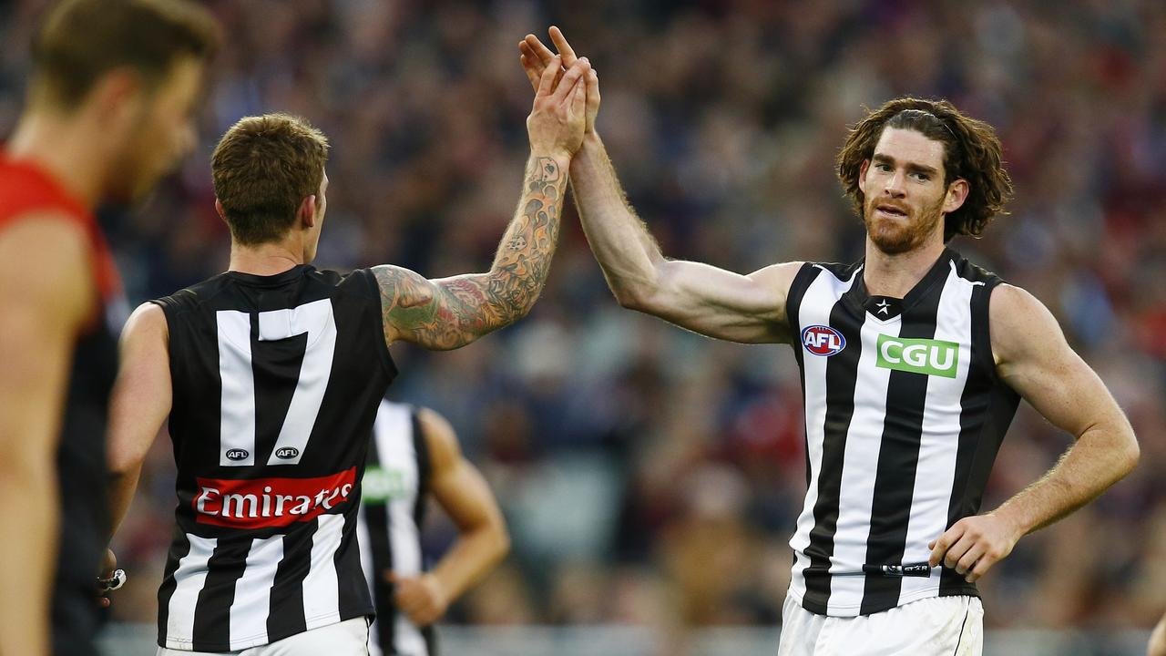 AFL Round 12 Melbourne v Collingwood at the MCG. Tyson Goldsack high 5's Dayne Beams after he goaled. Pic: Michael Klein. Monday June 9, 2014.