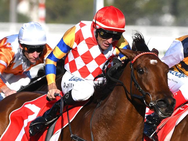 MELBOURNE, AUSTRALIA - APRIL 20:  Clayton Douglas riding Streets of Avalon defeats Dwayne Dunn riding Manolo Blahniq in Race 7 Ladbrokes Victoria Handicap during the Easter Cup Races at Caulfield Racecourse on April 20, 2019 in Melbourne, Australia. (Photo by Vince Caligiuri/Getty Images)