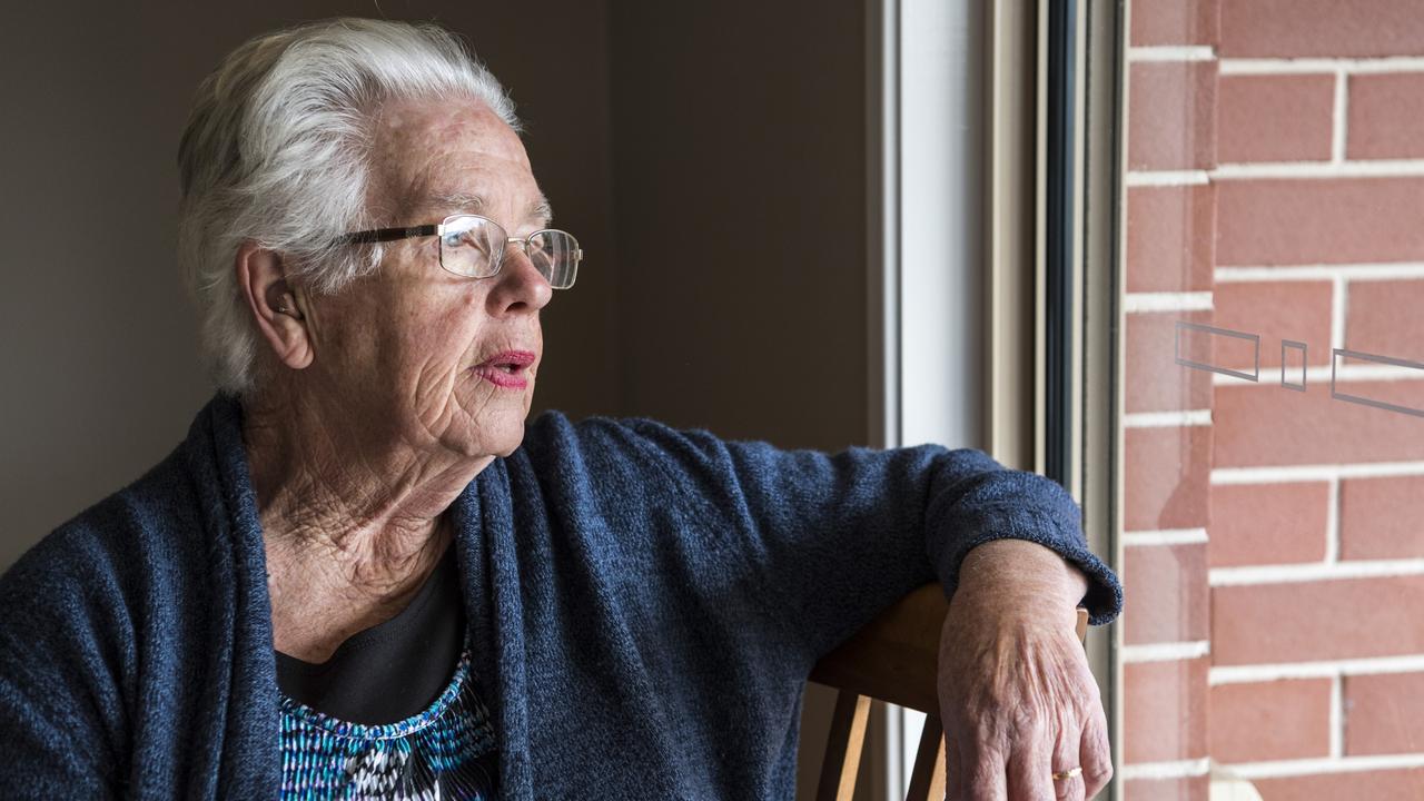 Janette Butler wants to do the right thing but finds it difficult without a phone to use the Check-In Queensland QR code reader. Picture: Kevin Farmer