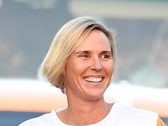 Former Olympian Susie O'Neill carries the Queen's Baton during its Relay in Brisbane, Friday, March 30, 2018. The Gold Coast Commonwealth Games kick off on April 4. (AAP Image/Dan Peled) NO ARCHIVING