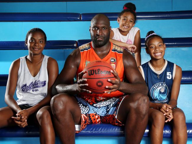 Taipans Nate Jawai with his niece Teyahna Bond, 13, daughter Kayah, 6, and niece Taryn Bond, 11. Picture: Stewart Mclean