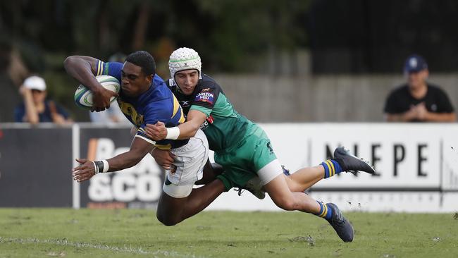 Josh Coward attempts a tackle on Savenaca Totovosau. Picture AAP