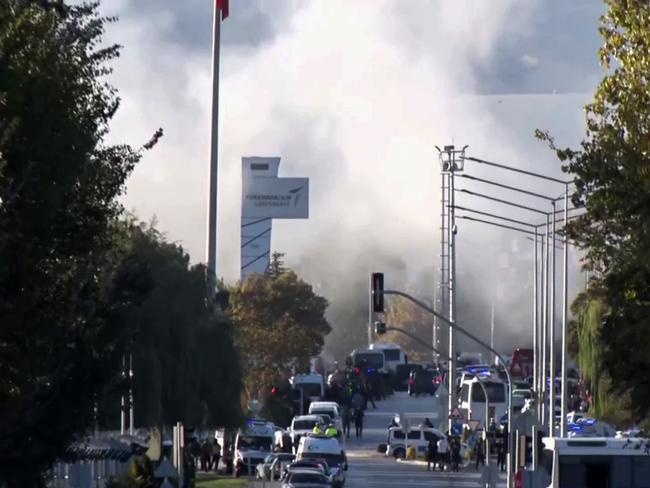 Smoke rises outside the scene of the attack. Picture: AP