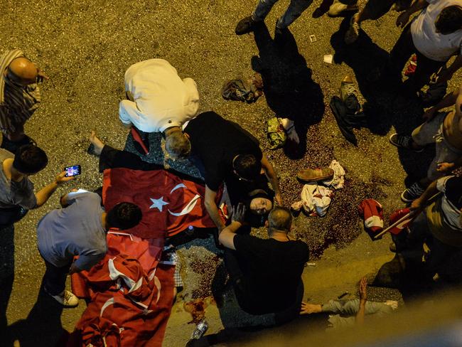 A wounded Turkish woman lies on the ground. Picture: Gokhan Sahin/Getty Images