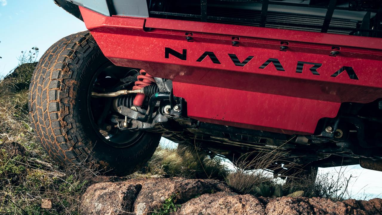 Red springs and bash plate point to the greater off-road capability of the Nissan Navara Pro-4X Warrior.