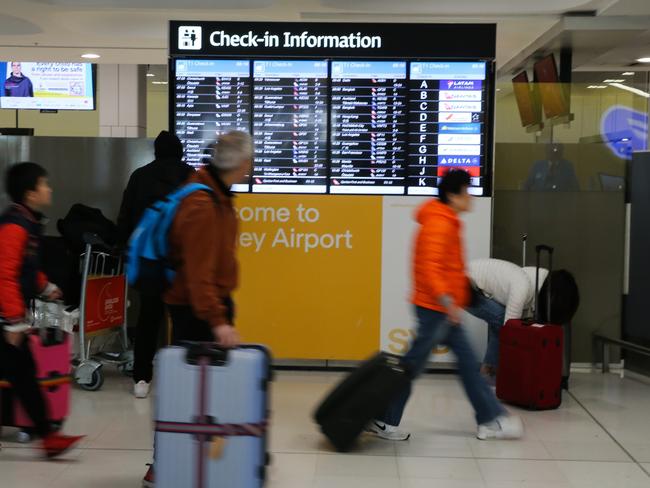 SYDNEY, AUSTRALIA  - AUGUST 15 2023: A general view of the Departures Terminal at Sydney International Airport, after a man who forced a Malaysia Airlines plane to make a dramatic turn back to Sydney International Airport after he became unruly and made references to Islam has been arrested. The MH122 Airbus-a330 flight to Kuala Lumpur was diverted back to Sydney and was isolated on the tarmac with AFP officers called to the emergency just before 4pm on Monday. Picture: NCA Newswire / Gaye Gerard