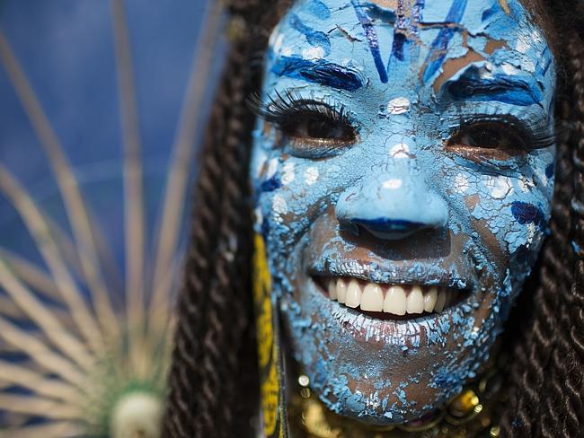 A reveller dressed as a character from the movie Avatar takes part in the “Ceu na Terra” block party in Rio de Janeiro.