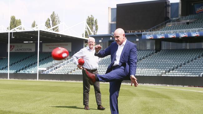 Premier Peter Gutwein kicking a football with Errol Stewart at UTAS Stadium in Launceston. AFL taskforce announcement. Picture: PATRICK GEE