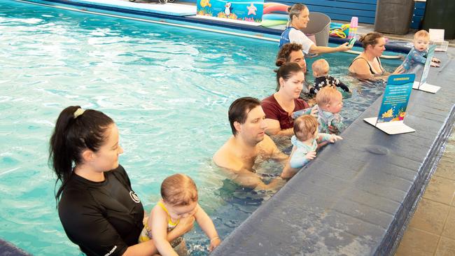 Toddlers receiving free swimming lessons from Bluefit Swimming at the Cotton Tree pool. Picture: Patrick Woods.