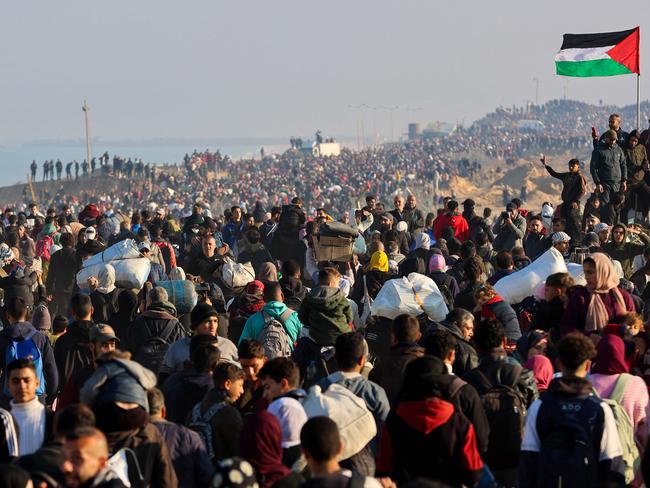 Displaced Gazans cross the Netzarim corridor from the southern Gaza Strip into Gaza City (Picture: Omar AL-QATTAA / AFP)