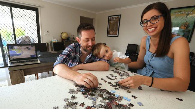 Opposites attract … Dylan and Clare Malloch with Edmund, 2, at home in Griffin, north of Brisbane. Picture: Lyndon Mechielsen