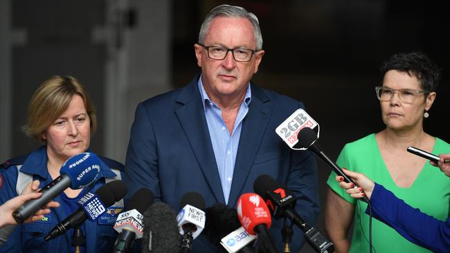 NSW Minister for Health Brad Hazzard, Dr Jo Mitchell, right and Dr Sarah Coombes, left, NSW Ambulance. Picture: AAP