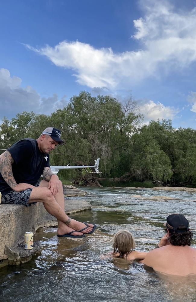 Matt Wright relaxes with family and friend in the Top End on Saturday.