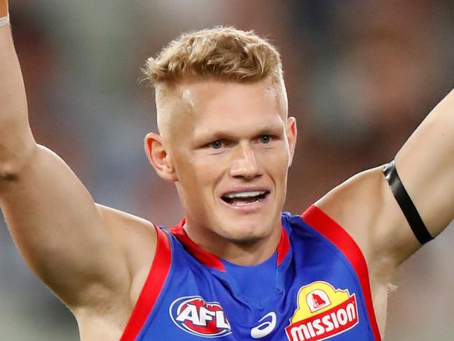 MELBOURNE, AUSTRALIA - MARCH 19: Adam Treloar of the Bulldogs celebrates during the 2021 AFL Round 01 match between the Collingwood Magpies and the Western Bulldogs at the Melbourne Cricket Ground on March 19, 2021 in Melbourne, Australia. (Photo by Michael Willson/AFL Photos via Getty Images)