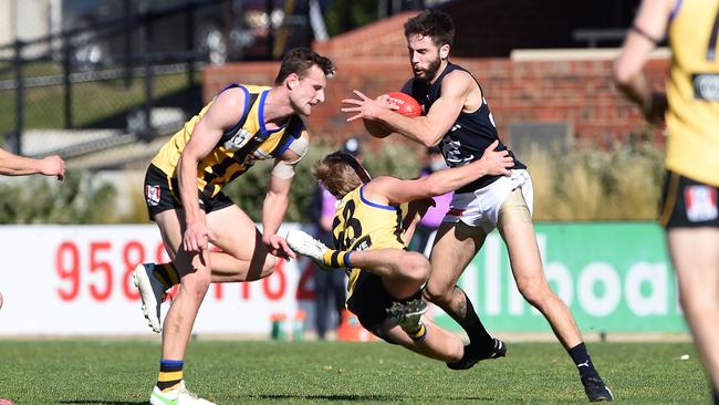 VFL Footy: Sandringham v Carlton at Sandringham, Riley Virtue gets some air in his tackle. Picture: Steve Tanner