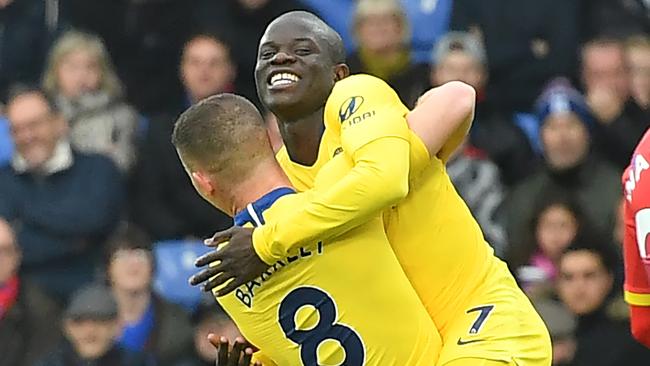 Chelsea's French midfielder N'Golo Kante (R) jumps into the arms of Chelsea's English midfielder Ross Barkley after he scores the opening goal of the English Premier League football match between Crystal Palace and Chelsea at Selhurst Park in south London on December 30, 2018. (Photo by Ben STANSALL / AFP) / RESTRICTED TO EDITORIAL USE. No use with unauthorized audio, video, data, fixture lists, club/league logos or 'live' services. Online in-match use limited to 120 images. An additional 40 images may be used in extra time. No video emulation. Social media in-match use limited to 120 images. An additional 40 images may be used in extra time. No use in betting publications, games or single club/league/player publications. /