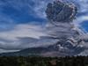 TOPSHOT - Mount Sinabung spews thick ash and smoke into the sky in Karo, North Sumatra on August 10, 2020. (Photo by Anto Sembiring / AFP)