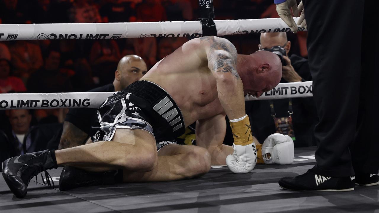 Barry Hall tries to drag himself off the canvas after being knocked down. Picture: No Limit Boxing/Gregg Porteous