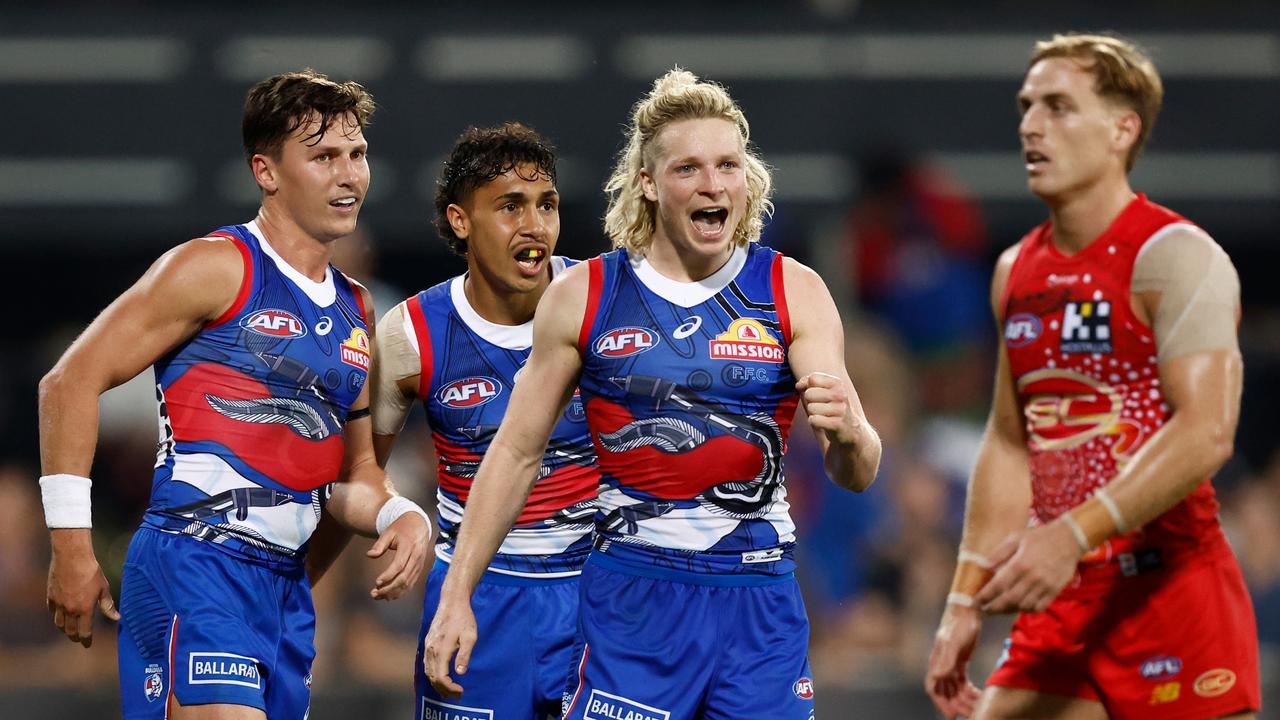 (L-R) Anthony Scott, Arthur Jones and Cody Weightman of the Bulldogs celebrate during the clash against the Gold Coast in Darwin. Photo by Michael Willson/AFL Photos via Getty Images