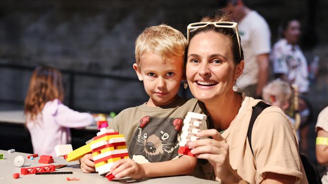 Arlo Chenard, 5, constructs a Lego building with the help of his mother Brodie Chenard at the Brick Mania tank, part of the final day of the Cairns Children's Festival, held at the Tanks Arts Centre, Edge Hill. Picture: Brendan Radke
