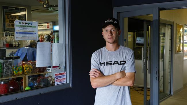 The Cairns International Tennis Centre was broken into twice on early Monday morning, with the burglars stealing a car owned by Tennis Queensland. Head coach assistant of Baseline Tennis coaching academy Alwyn Musumeci stands in front of the glass panel doors that were smashed to enter the tennis clubhouse and offices. Picture: Brendan Radke