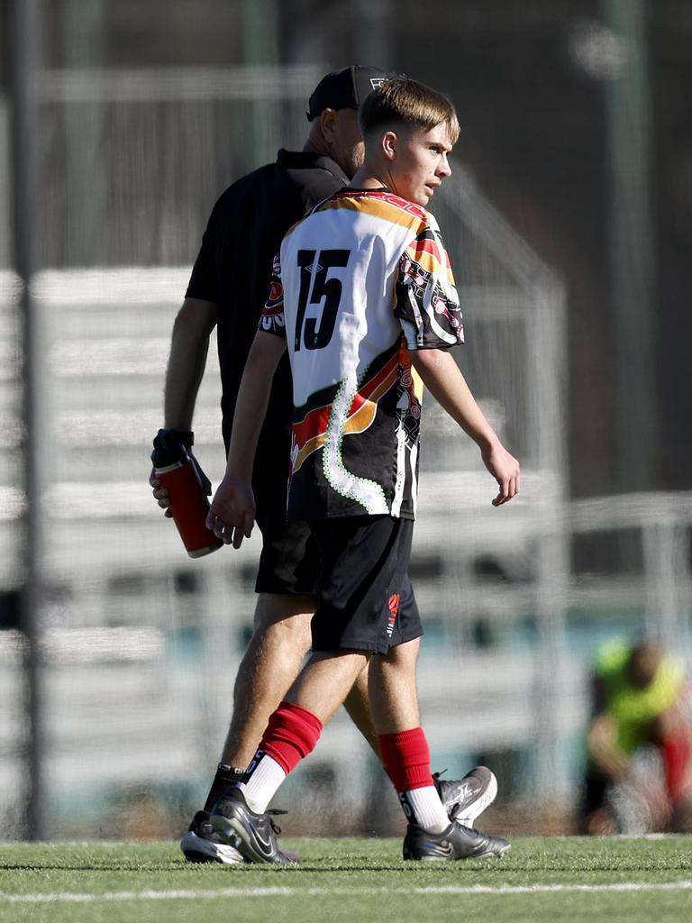 Charlie Robinson comes off with an injury. Picture: Michael Gorton. U16 Boys NAIDOC Cup at Lake Macquarie Regional Football Facility.