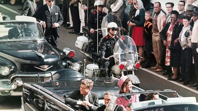 President John F. Kennedy's motorcade travels through Dallas on that fateful day.