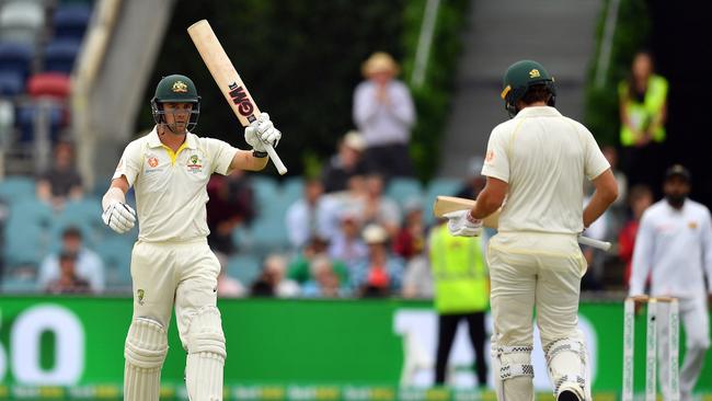 Centuries to Travis Headand Joe Burns have placed additional pressure on Khawaja. (Photo by Saeed KHAN / AFP) 