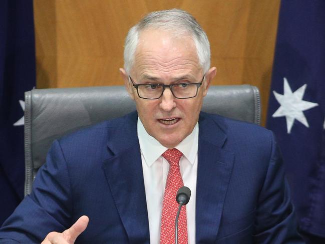 The Prime Minister Malcolm Turnbull with the Minister for the Environment and Energy Josh Frydenberg during a press conference at Parliament House in Canberra. Picture Gary Ramage