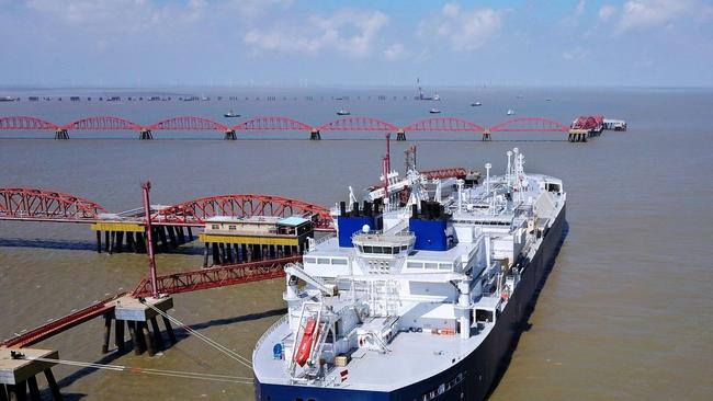 A vessel carrying LNG unloads at a Chinese terminal. Picture: Reuters