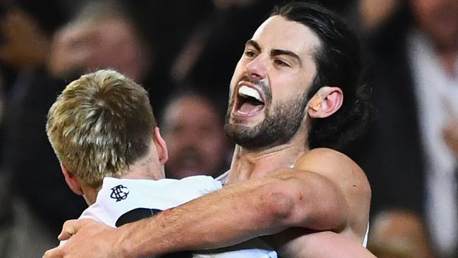 Brodie Grundy celebrates a goal with teammate Jordan De Goey, who is out of contract at the end of next year.