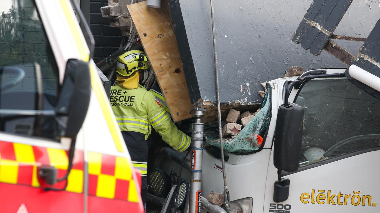 Despite being trapped, the driver somehow only has minor grazing. Picture: NewsWire / Gaye Gerard