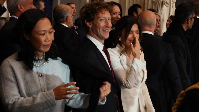 Lauren Sanchez giggles as she chats to Mark Zuckerberg, as the Meta founder’s wife Priscilla Chan appears to avoid eye contact with the partner of Jeff Bezos. Picture: Getty Images