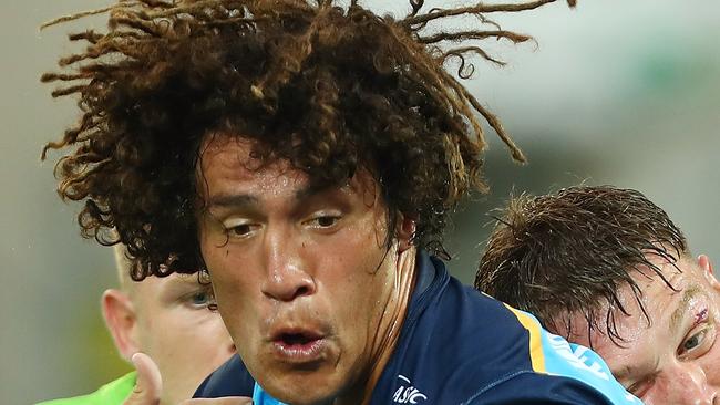 GOLD COAST, AUSTRALIA — MARCH 11: Kevin Proctor of the Titans is tackled during the round one NRL match between the Gold Coast Titans and the Canberra Raiders at Cbus Super Stadium on March 11, 2018 in Gold Coast, Australia. (Photo by Chris Hyde/Getty Images)