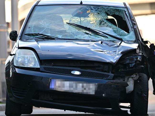 A damaged car is pictured at the site of a car ramming attack in Mannheim, southwestern Germany on March 3, 2025. A car driven into a crowd in southwest Germany on Monday killed two people, authorities said, adding they had arrested a 40-year-old German man after the incident. (Photo by Thomas LOHNES / AFP)