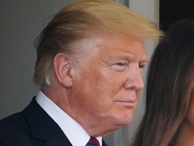 (FILES) In this file photo taken on August 27, 2018 US President Donald Trump and First Lady Melania Trump bid farewell to Kenyan President Uhuru Kenyatta and his wife Margaret Kenyatta outside of the West Wing of the White House in Washington,DC. - President Donald Trump will visit Pittsburgh on October 30, 2018 to show support after a gunman killed 11 people in a massacre at a synagogue, his spokeswoman said October 29, 2018. "Tomorrow, the president and first lady will travel to Pennsylvania to express the support of the American people and grieve with the Pittsburgh community," spokeswoman Sarah Sanders told journalists.  The killings on Saturday marked the worst anti-Semitic attack in recent US history. (Photo by MANDEL NGAN / AFP)