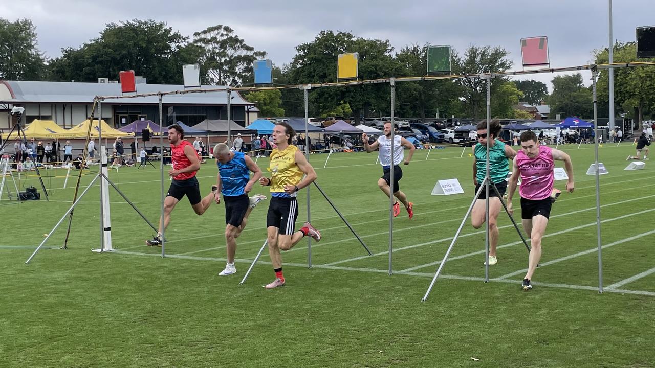 Tom Perry (yellow) wins his heat in the semi-final of the Ballarat Gift. Picture: Shane Jones.