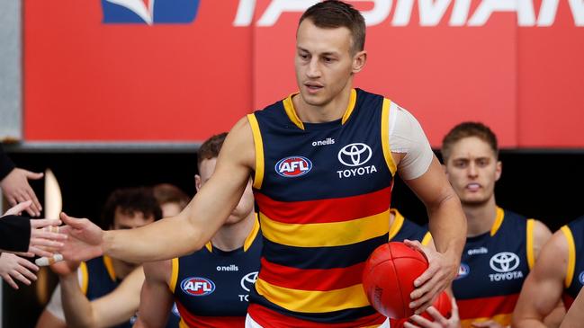 HOBART, AUSTRALIA - JUNE 26: Tom Doedee of the Crows leads his team up the race during the 2022 AFL Round 15 match between the North Melbourne Kangaroos and the Adelaide Crows at Blundstone Arena on June 26, 2022 in Hobart, Australia. (Photo by Dylan Burns/AFL Photos via Getty Images)