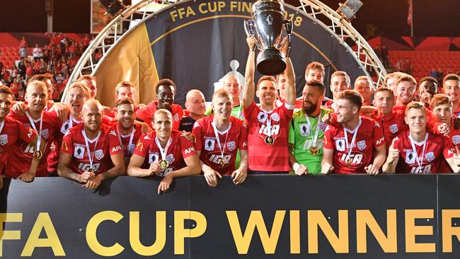 Adelaide United players celebrate after winning the FFA Cup. Picture: AAP