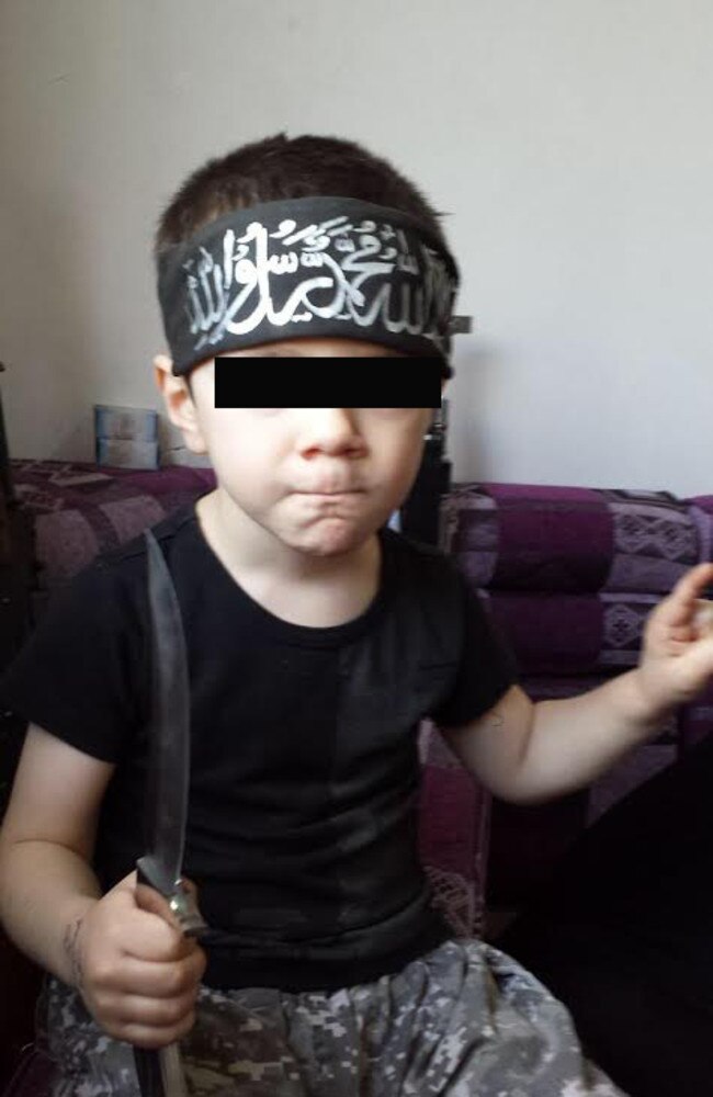 Sharrouf’s eight-year-old son Humzeh brandishes a knife in the video in which he describes how he would kill Australians.