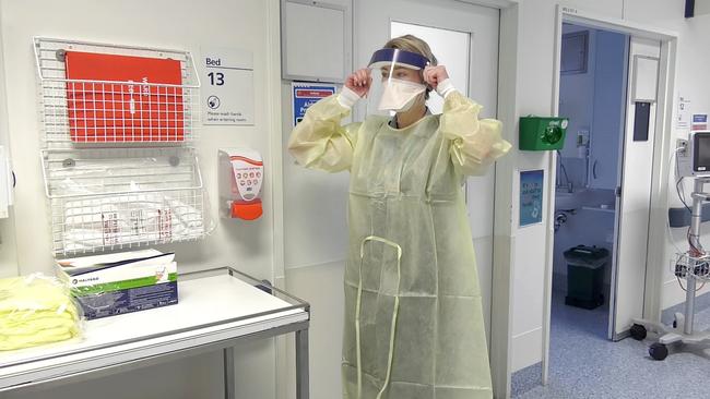 Queensland Health supplied image of an isolation ward and the personal protective equipment used to protect health workers.