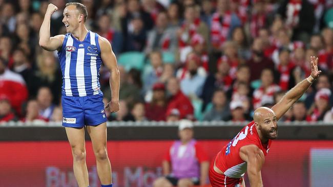 SYDNEY, AUSTRALIA - MAY 05:  Billy Hartung of the Kangaroos celebrates kicking a goal as Jarrad McVeigh of the Swans appeals for a touch during the round seven AFL match between the Sydney Swans and the North Melbourne Kangaroos at Sydney Cricket Ground on May 5, 2018 in Sydney, Australia.  (Photo by Mark Metcalfe/Getty Images)