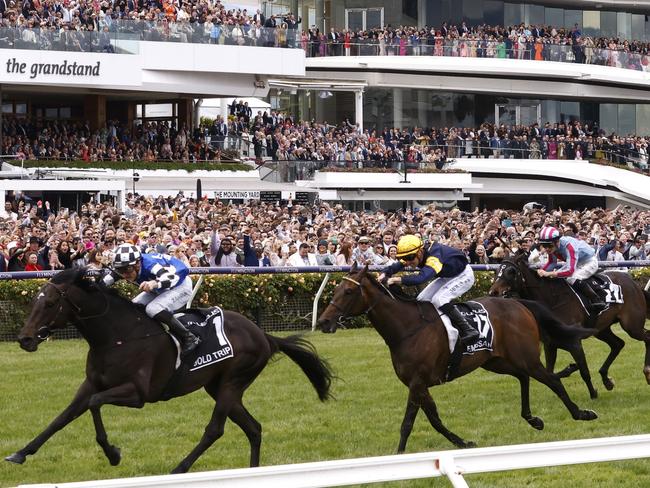 MELBOURNE, AUSTRALIA - NOVEMBER 01: Mark Zahra riding #1 Gold Trip leads Patrick Moloney riding #17 Emissary and Teo Nugent riding #22 High Emocean to win race seven, the Lexus Melbourne Cup during 2022 Melbourne Cup Day at Flemington Racecourse on November 01, 2022 in Melbourne, Australia. (Photo by Daniel Pockett/Getty Images)