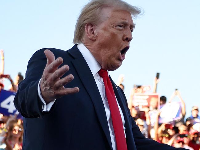 COACHELLA, CALIFORNIA - OCTOBER 12: Republican presidential nominee, former U.S. President Donald Trump gestures as he walks onstage for a campaign rally on October 12, 2024 in Coachella, California. With 24 days to go until election day, former President Donald Trump is detouring from swing states to hold the rally in Democratic presidential nominee, Vice President Kamala Harris' home state.   Mario Tama/Getty Images/AFP (Photo by MARIO TAMA / GETTY IMAGES NORTH AMERICA / Getty Images via AFP)