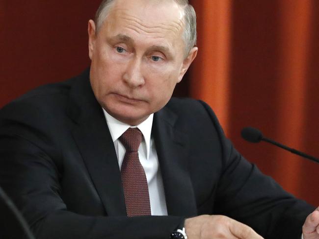Russian Vladimir Putin attends a meeting with Russian ambassadors to foreign countries in Moscow, Russia, Thursday, July 19, 2018. Putin says his first summit with U.S. President Donald Trump was 