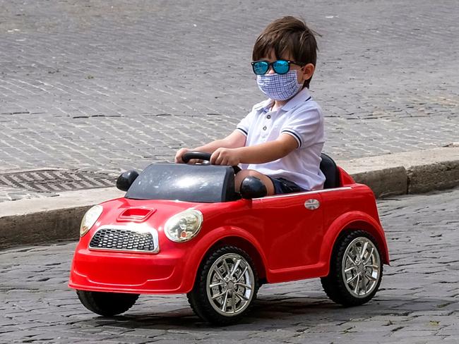 A boy turns a near-empty Piazza Navona in Rome into a race track. Picture: AFP