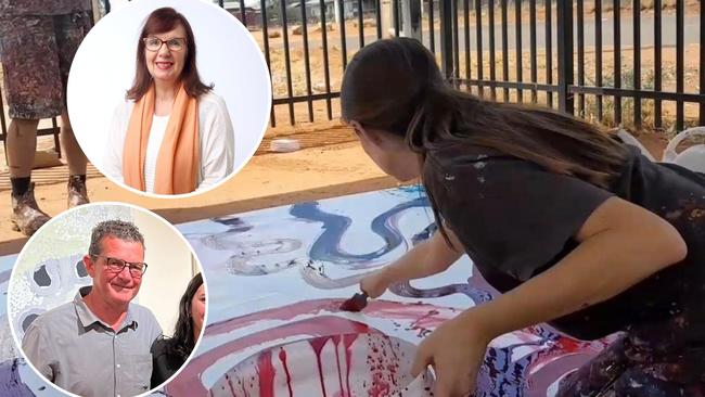 The Australian’s senior arts writer Rosemary Neill, Desart CEO Philip Watkins and a manager at the APYACC daubing on an Indigenous paining, revealed as part of the ‘white hands on black art’ investigation.